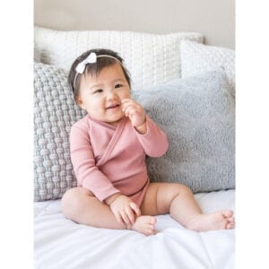 Cute baby in a Long sleeve kimono style baby onesie in pink