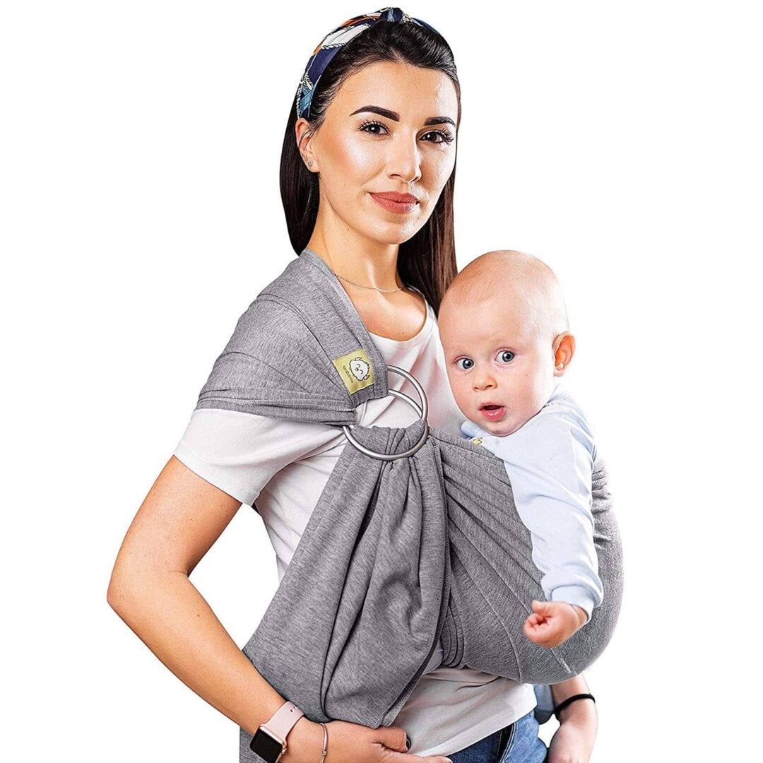 Woman holding baby in wrap carrier sling