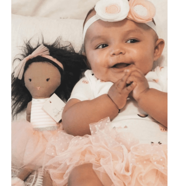 Pretty African American Baby Girl with ballerina doll