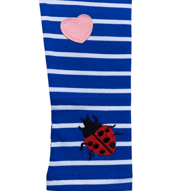Blue and white striped kids leggings with flowers and bug appliques sown on the front