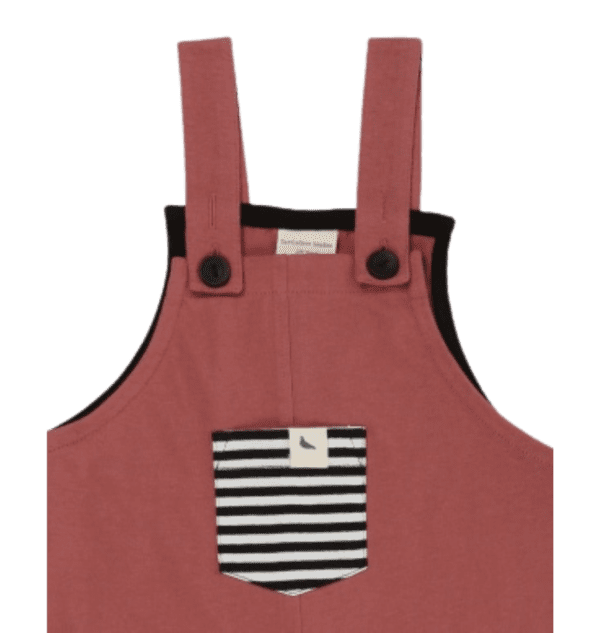 Toddlers pink organic cotton overalls with cute black pocket on front